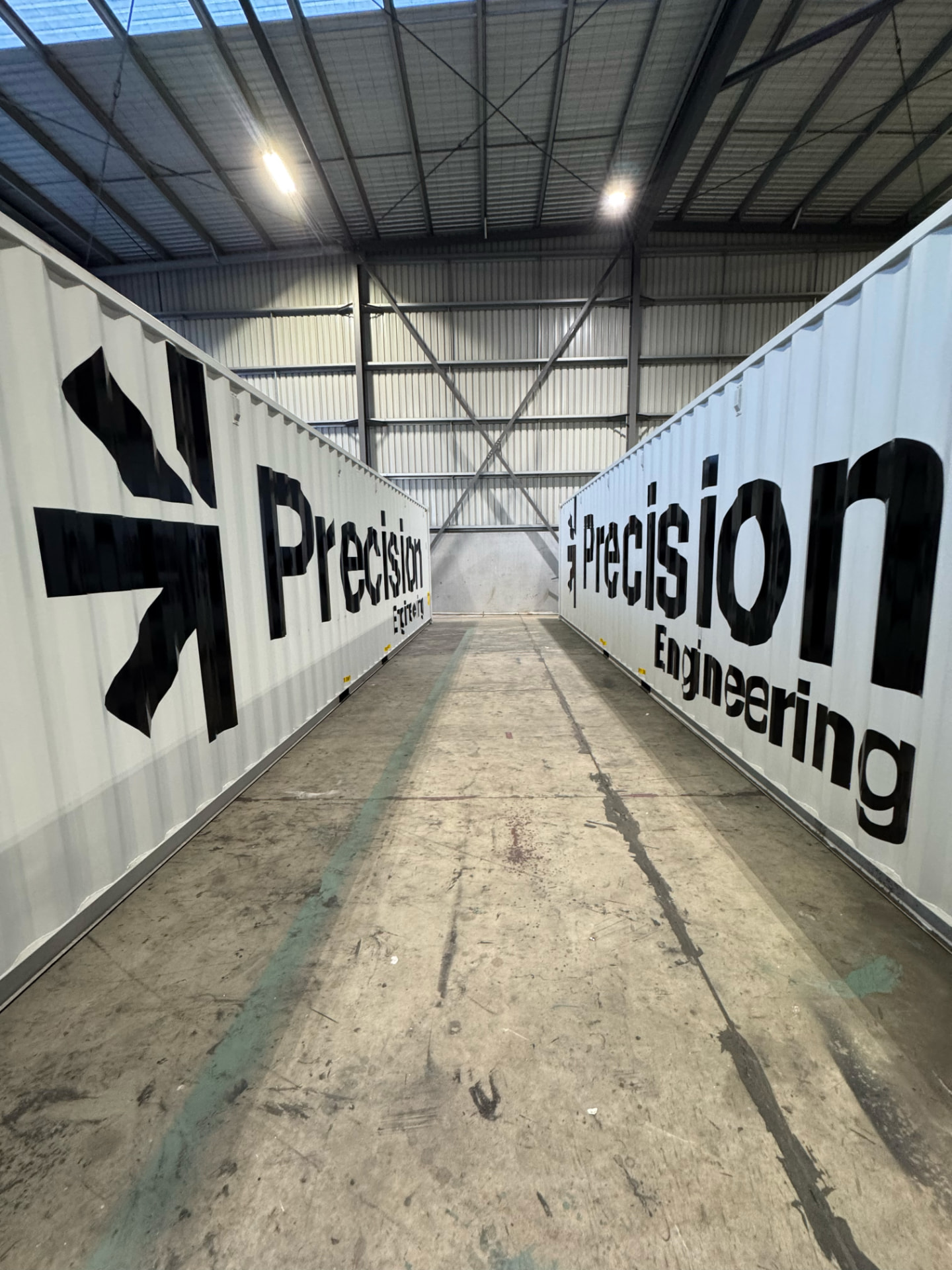 Shipping container signage with bold fabricated lettering